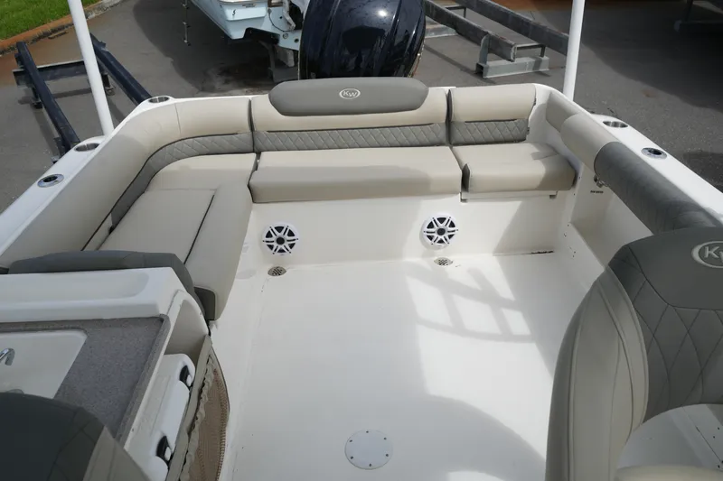 Slide: The Image of 2026 Key West 239 DFS boat interior with cushioned seating and speakers. - 31