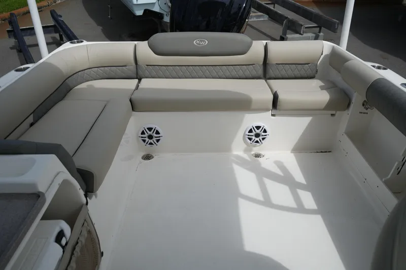 Slide: The Image of 2026 Key West 239 DFS boat interior with cushioned seating and built-in speakers. - 33