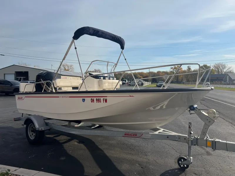 Slide: The Image of 2019 Boston Whaler 170 Montauk boat deck with clean, white surface and railing. - 4