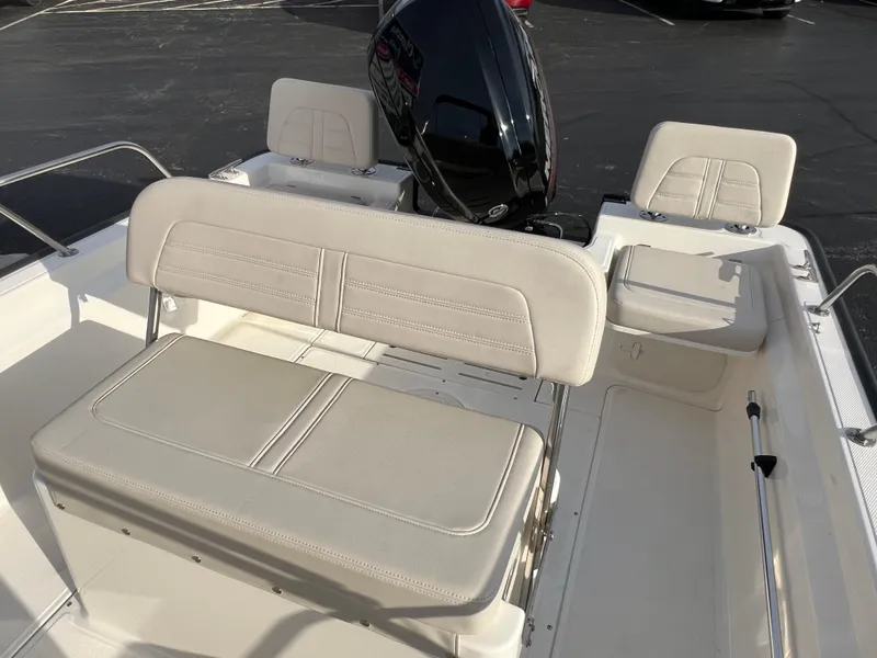Slide: The Image of 2019 Boston Whaler 170 Montauk boat deck, featuring clean white surface and railing. - 5