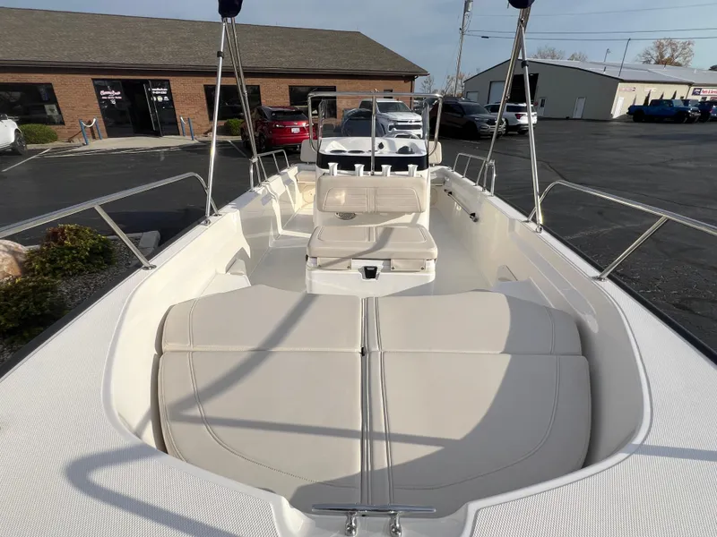 Slide: The Image of 2019 Boston Whaler 170 Montauk boat interior with seating and motor. - 7