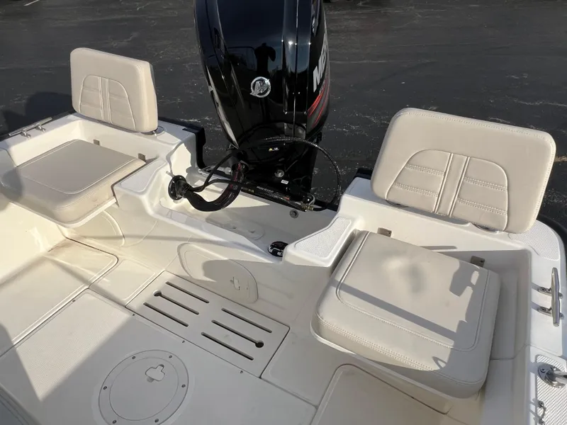 Slide: The Image of 2019 Boston Whaler 170 Montauk boat interior with seating and rod holders. - 9