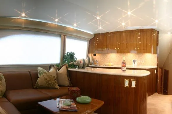 Slide: The Image of Luxurious interior of 2026 Buddy Davis 58 Sportfisherman yacht with elegant wood finishes. - 4