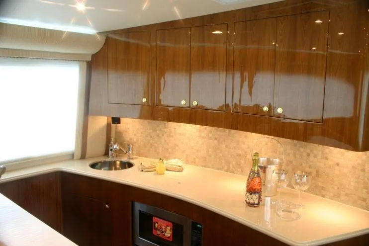 Slide: The Image of Luxurious kitchen interior of 2026 Buddy Davis 58 Sportfisherman yacht with sleek cabinetry. - 5