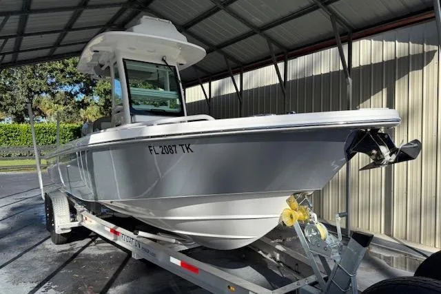 Slide: The Image of 2023 Everglades 253 Center Console boat on trailer in covered storage. - 13