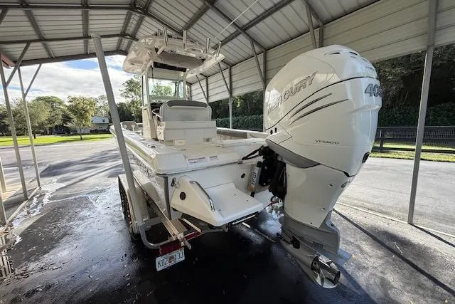 Slide: The Image of 2023 Everglades 253 Center Console boat with Mercury 400 engine in covered storage. - 8
