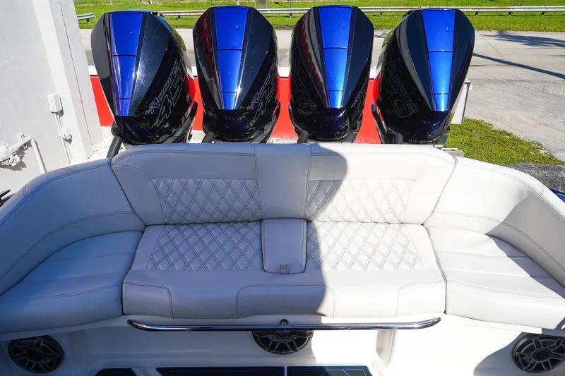 Slide: The Image of 2020 Nor-Tech 390 Center Console with quad engines and luxurious white seating. - 10