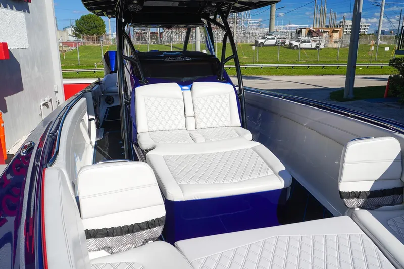 Slide: The Image of 2020 Nor-Tech 390 Center Console boat with luxurious white seating and sleek design. - 12