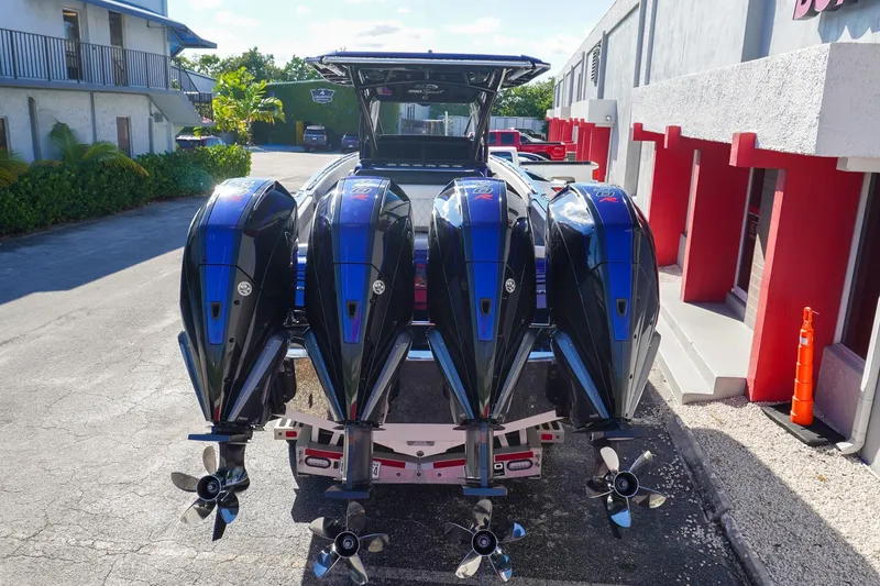 Slide: The Image of 2020 Nor-Tech 390 Center Console with four powerful outboard engines. - 2