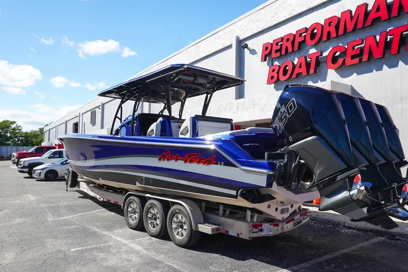 Slide: The Image of 2020 Nor-Tech 390 Center Console boat with triple engines at Performance Boat Center. - 4