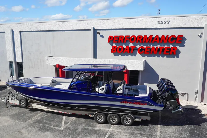 Slide: The Image of 2020 Nor-Tech 390 Center Console boat at Performance Boat Center, featuring triple engines. - 6