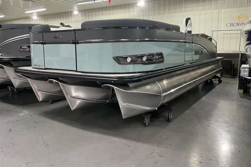 The Image of 2026 Avalon Catalina pontoon boat in showroom, showcasing sleek design and modern features. - 1