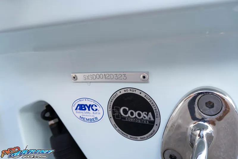 Slide: The Image of 2023 Sea Hunt Escape 23 boat with ABYC and Coosa Composites labels. - 16