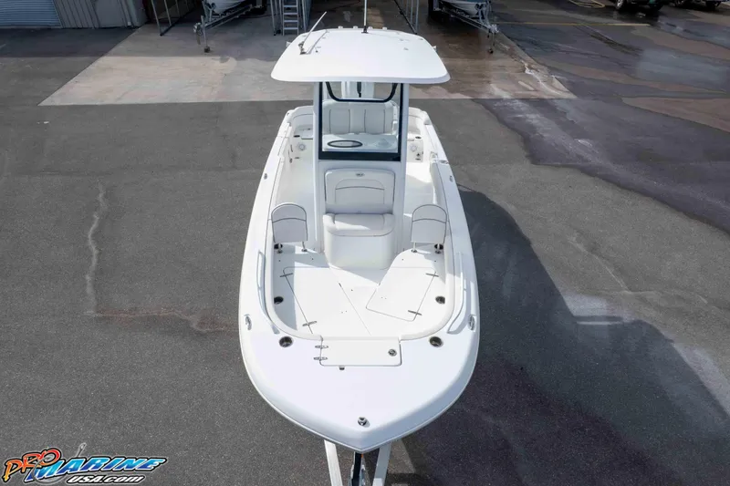 Slide: The Image of 2023 Sea Hunt Escape 23 boat, aerial view, docked on concrete surface. - 21
