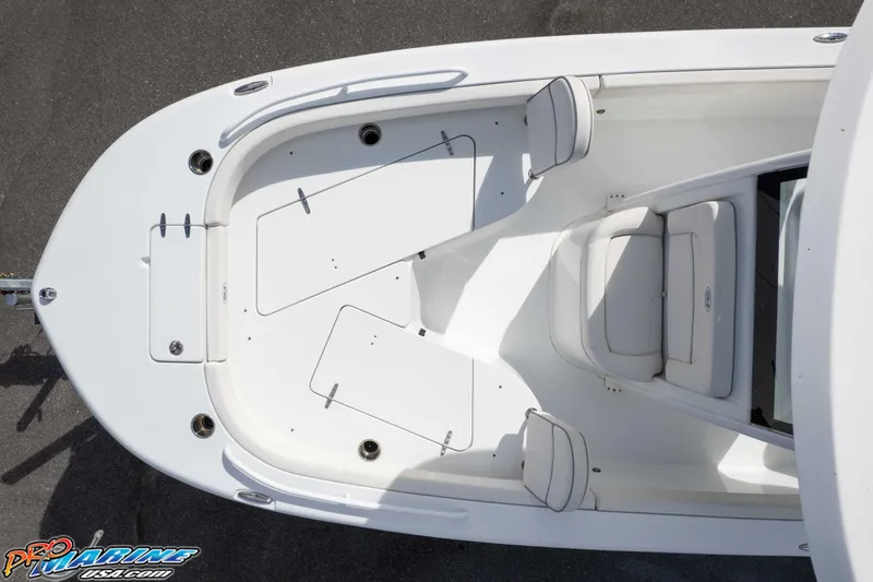 Slide: The Image of 2023 Sea Hunt Escape 23 boat interior, featuring spacious seating and storage compartments. - 23