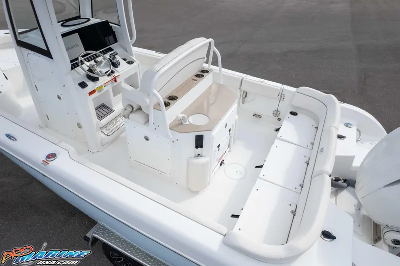 Slide: The Image of 2023 Sea Hunt Escape 23 boat interior with helm, seating, and storage compartments. - 27