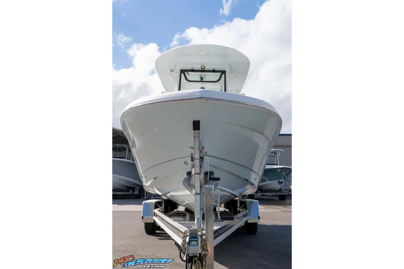 Slide: The Image of 2023 Sea Hunt Escape 23 boat on trailer under blue sky. - 33