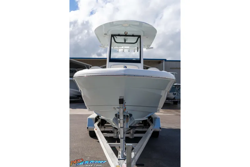 Slide: The Image of 2023 Sea Hunt Escape 23 boat on trailer, front view under cloudy sky. - 34