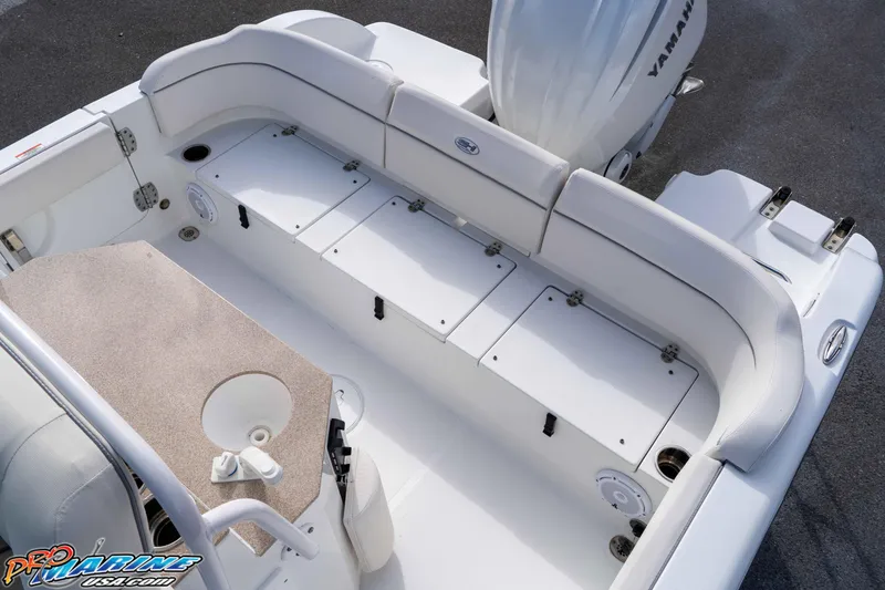 Slide: The Image of 2023 Sea Hunt Escape 23 boat interior with seating and storage compartments. - 41