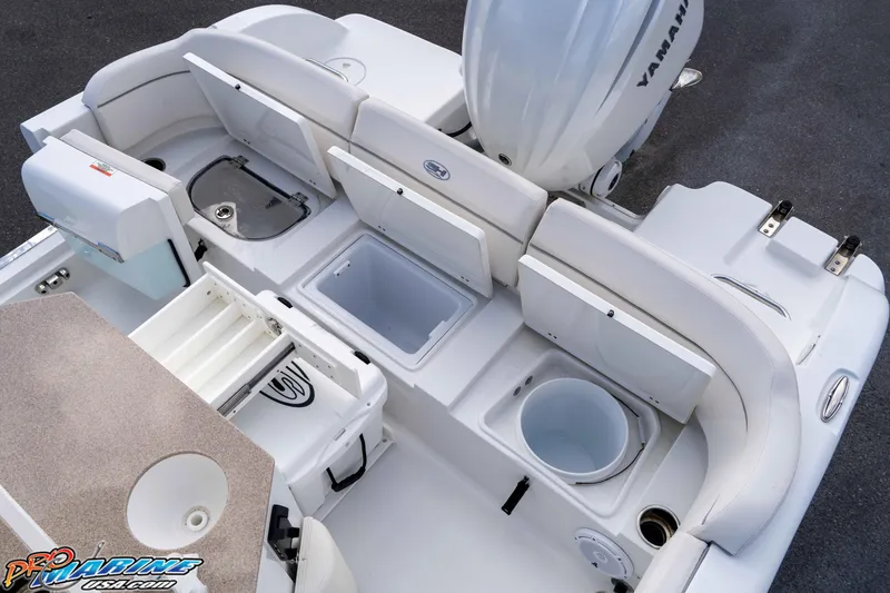 Slide: The Image of 2023 Sea Hunt Escape 23 boat interior with storage compartments and Yamaha engine. - 42