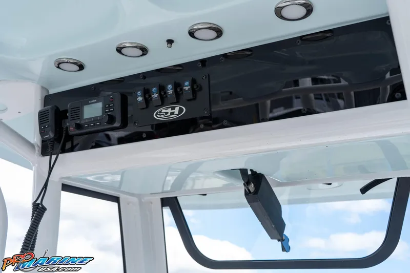 Slide: The Image of 2023 Sea Hunt Escape 23 boat console with Garmin radio and control panel. - 50