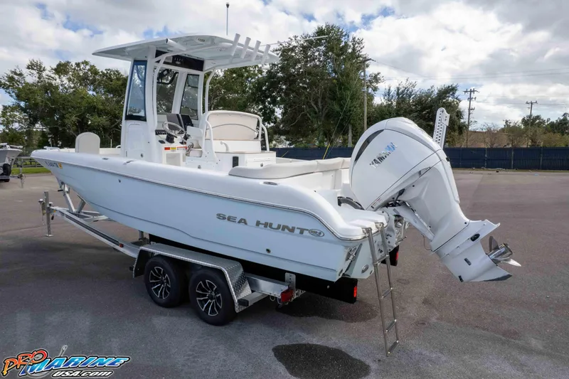 Slide: The Image of 2023 Sea Hunt Escape 23 boat on trailer, featuring Yamaha outboard motor. - 6
