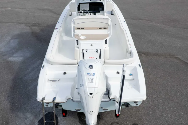 Slide: The Image of 2023 Sea Hunt Escape 23 boat, aerial view, featuring Yamaha engine and spacious seating. - 9
