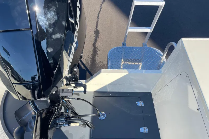 Slide: The Image of 2026 Hewescraft 200 Pioneer boat with Mercury engine and metal ladder. - 14