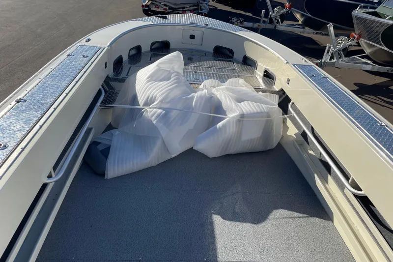 Slide: The Image of 2026 Hewescraft 200 Pioneer boat interior with protective wrapping on deck. - 20