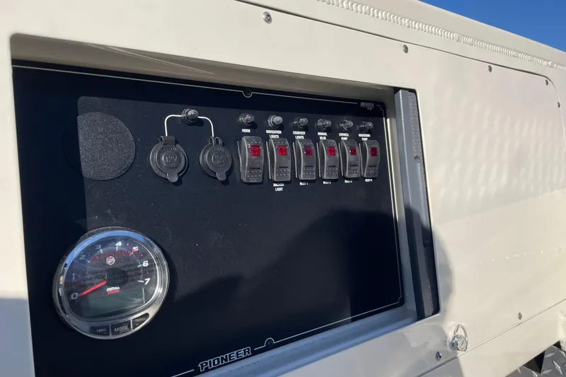 Slide: The Image of Control panel of 2026 Hewescraft 200 Pioneer boat with switches and gauge. - 9