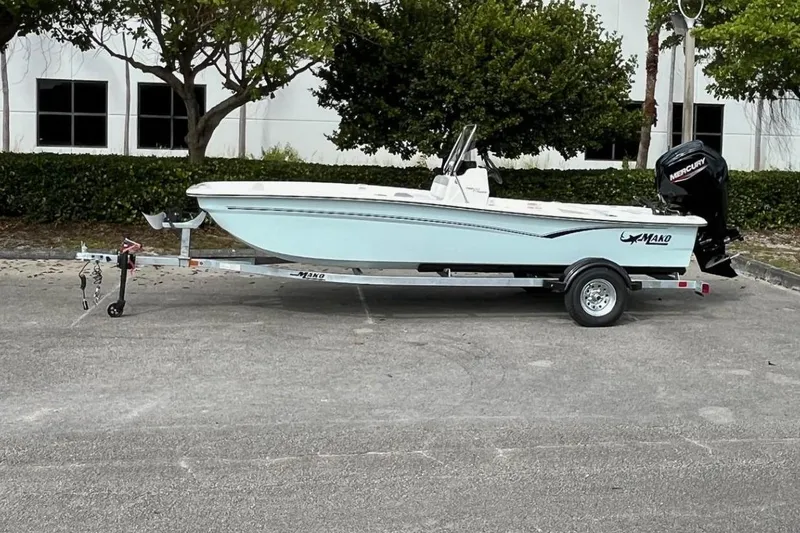 The Image of 2026 Mako Pro Skiff 17 CC boat on trailer, parked outdoors. - 0