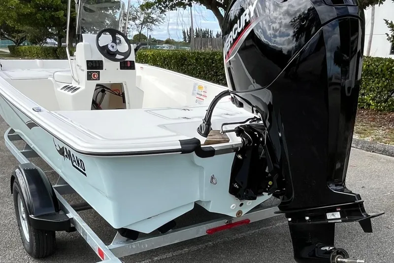 Slide: The Image of 2026 Mako Pro Skiff 17 CC boat on trailer with Mercury outboard motor. - 3