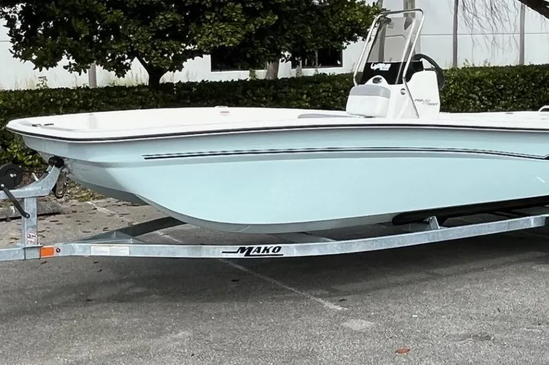 Slide: The Image of 2026 Mako Pro Skiff 17 CC boat on trailer, parked outdoors. - 4