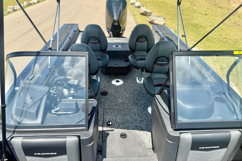 Slide: The Image of 2026 Tracker Targa V-19 WT boat interior with seating and steering console. - 13