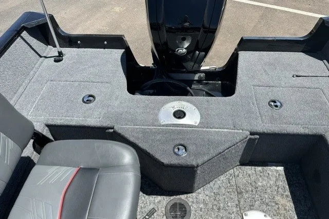 Slide: The Image of 2026 Tracker Pro Guide V-16 SC boat interior with gray seating and carpeted deck. - 16