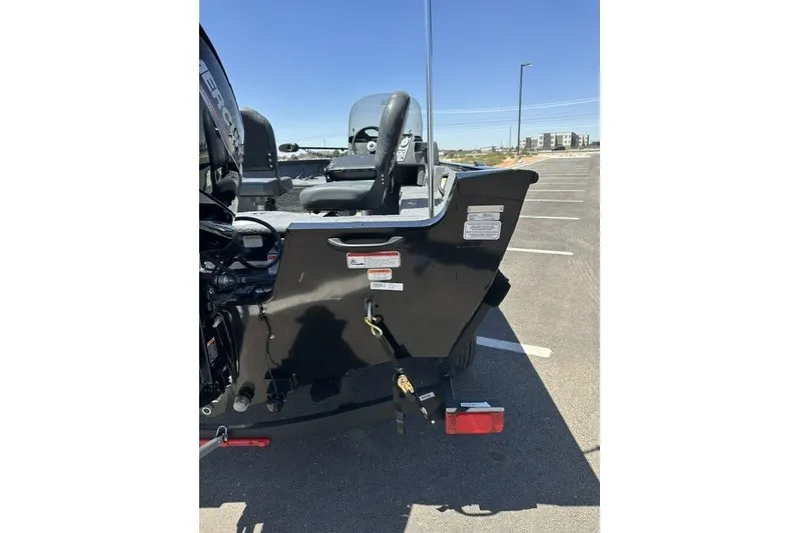 Slide: The Image of 2026 Tracker Pro Guide V-16 SC boat rear view in parking lot. - 60