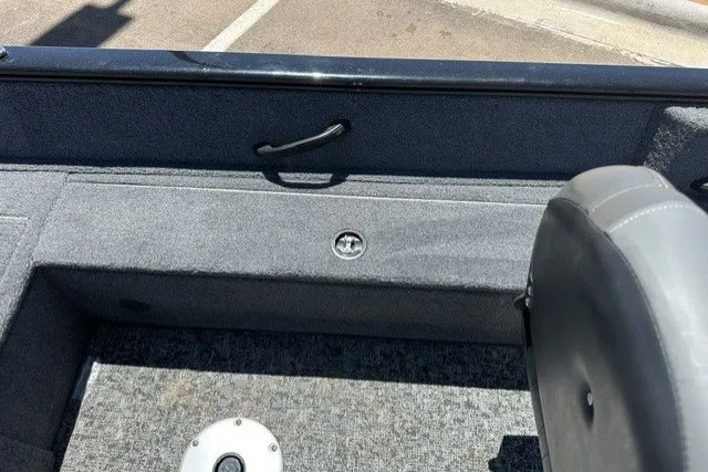 Slide: The Image of 2026 Tracker Pro Guide V-16 SC boat interior with gray upholstery and seating. - 17