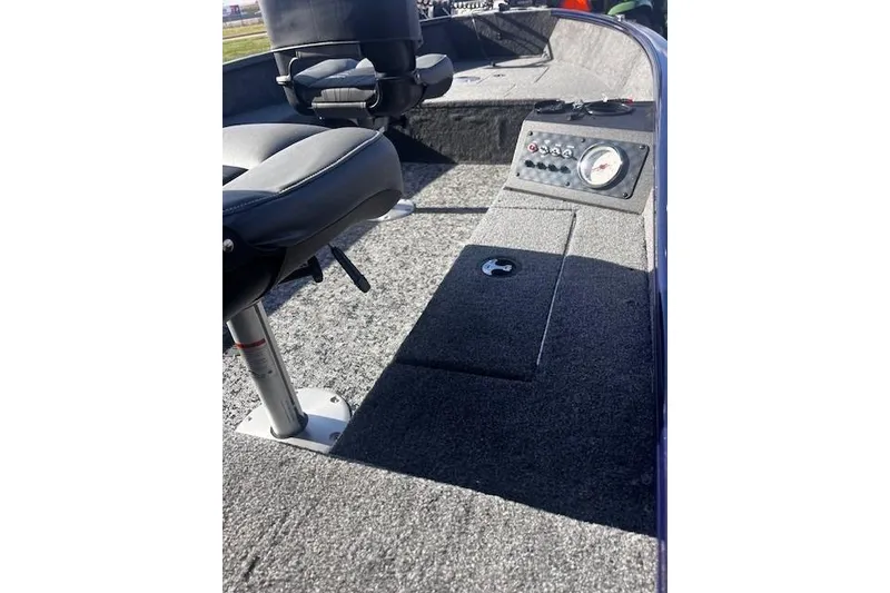 Slide: The Image of 2026 Tracker Super Guide V-16 T boat interior with seating and control panel. - 30