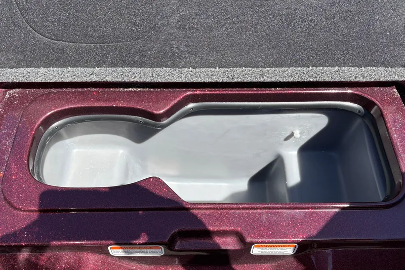 Slide: The Image of Open storage compartment of 2026 Nitro Z21 XL Pro boat. - 38