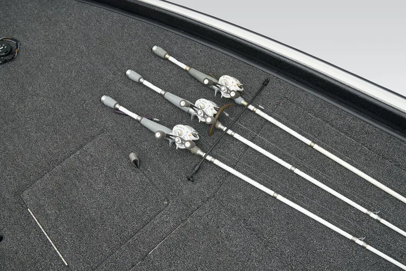 Slide: The Image of 2026 Nitro Z21 XL Pro boat storage compartment with open lid, showcasing carpeted interior. - 17