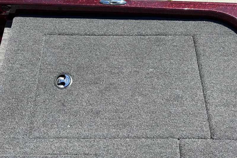 Slide: The Image of Carpeted deck of 2026 Nitro Z21 XL Pro boat with storage hatch. - 45