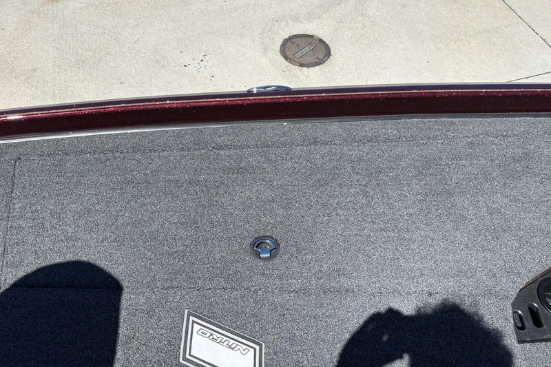 Slide: The Image of 2026 Nitro Z21 XL Pro boat deck with carpet and logo, featuring a metal hook. - 35