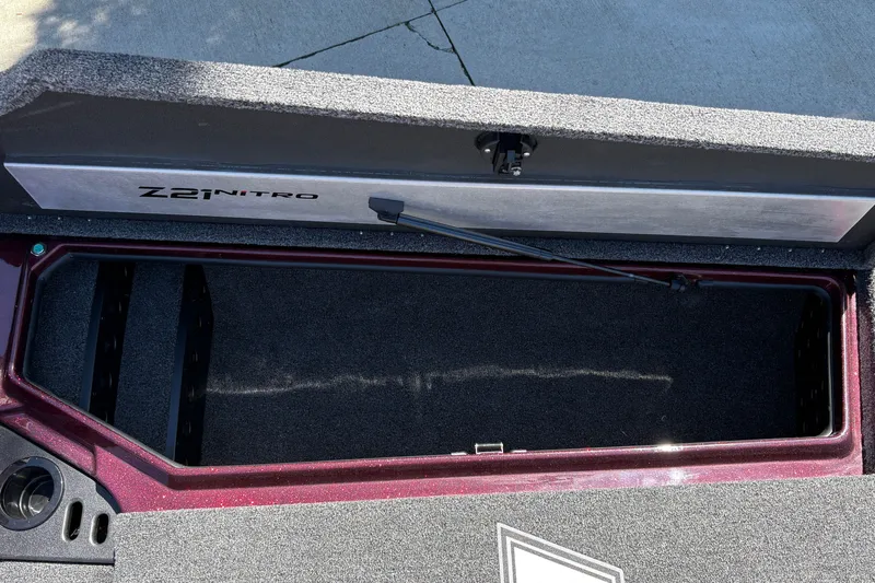 Slide: The Image of Open storage compartment of 2026 Nitro Z21 XL Pro boat, showcasing interior space. - 32