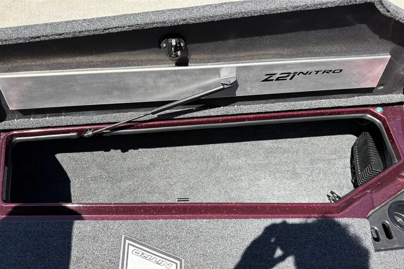Slide: The Image of Open storage compartment of 2026 Nitro Z21 XL Pro boat, showcasing interior space. - 33