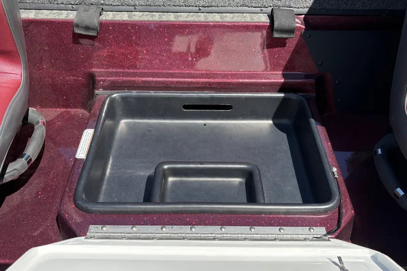Slide: The Image of Storage compartment in a 2026 Nitro Z21 XL Pro boat, featuring a sleek black interior. - 27