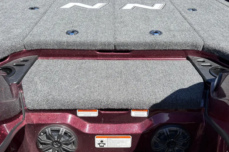 Slide: The Image of 2026 Nitro Z21 XL Pro boat deck with carpeted surface and speaker system. - 37