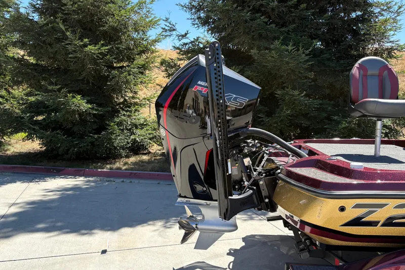 Slide: The Image of 2026 Nitro Z21 XL Pro boat with powerful Mercury engine, parked outdoors. - 8