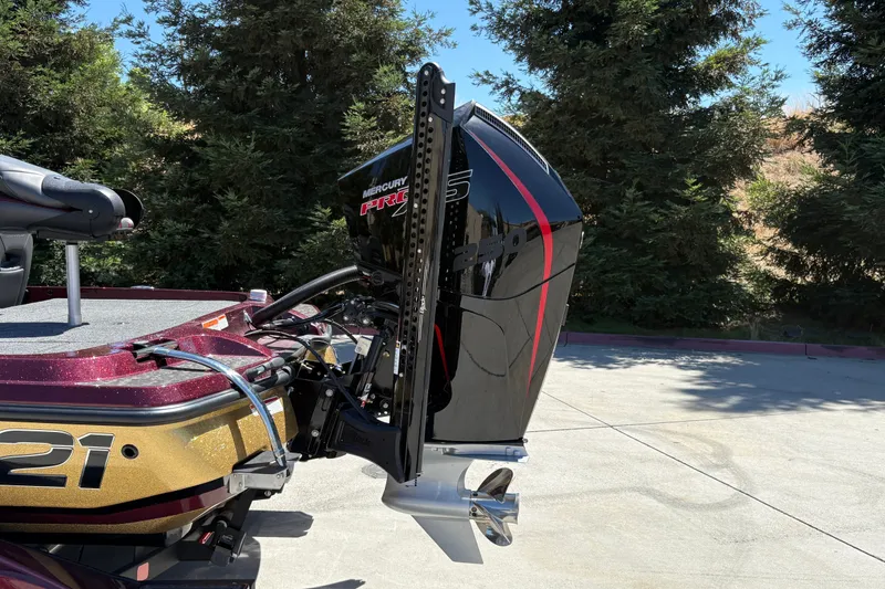 Slide: The Image of 2026 Nitro Z21 XL Pro boat with Mercury Pro XS engine, parked outdoors. - 9