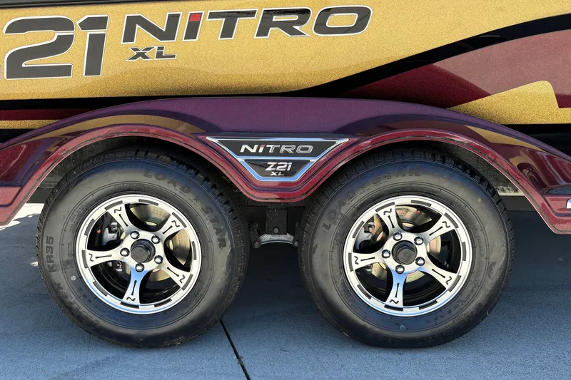Slide: The Image of 2026 Nitro Z21 XL Pro trailer with dual Load Star tires and stylish rims. - 10