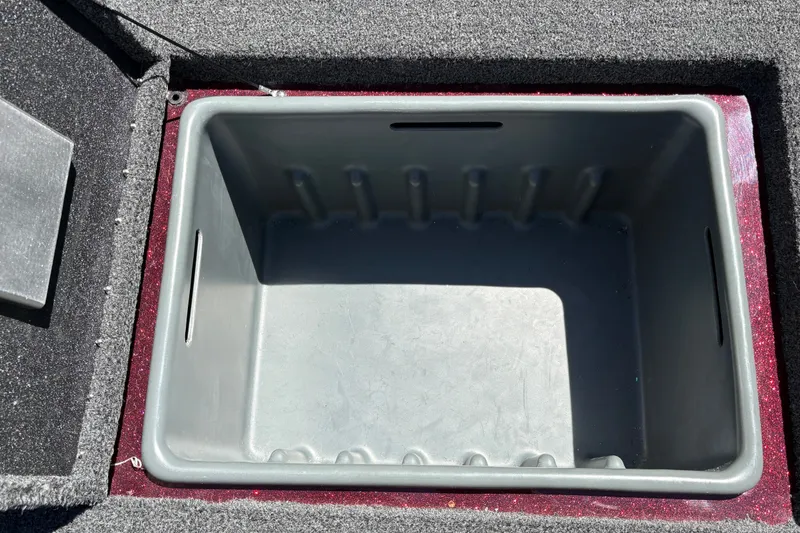 Slide: The Image of 2026 Nitro Z21 XL Pro boat storage compartment, open and empty. - 29